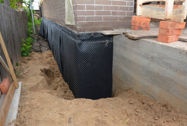 SJ Waterproofing Pros technician performing targeted Emergency Waterproofing assessment in Perrysburg, OH